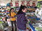 Saleswoman (right) and customer (left) in a retail shop -  DaWangMiaoZhen, Suizhong, Huludao, Liaoning